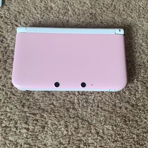 Pink Nintendo 3DS XL, comes with 7 games, case, and charger